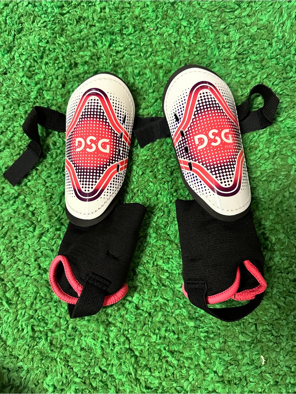 DSG Kids Red, White and Black Shin Guards with Pink Accents